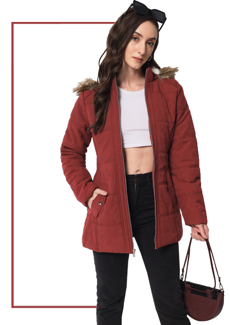 A woman wearing a full sleeve quilted Jacket in Rust(reddish brown) color featuring faux fur hood, front zip closure, side pockets and regular fit.