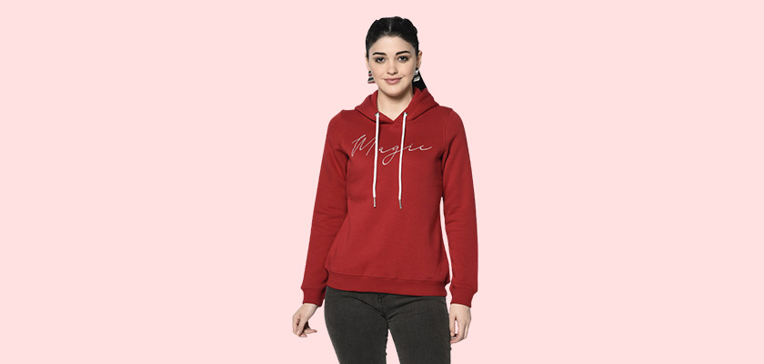 A woman wearing a Red Hoodie with ribbed cuff, drawstring and pocket in hand designed for mild winter