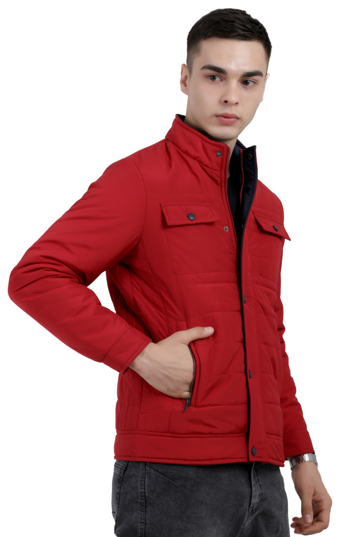 A right pose of a Red quilted jacket with a high neck collar, zipper closure and pocket in hand designed for casual winter layering and comfort.