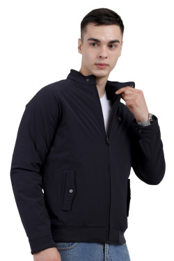 A right pose of a man wearing Navy quilted jacket with a high neck collar, zipper closure and pocket in hand designed for casual winter layering and comfort.