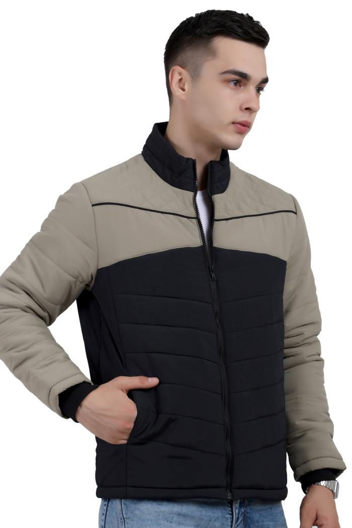 A right pose of a man wearing a Black-Camel dual Tone Quilted Jacket with mock collar, zipper closure and pocket in hand designed for casual winter layering and comfort.