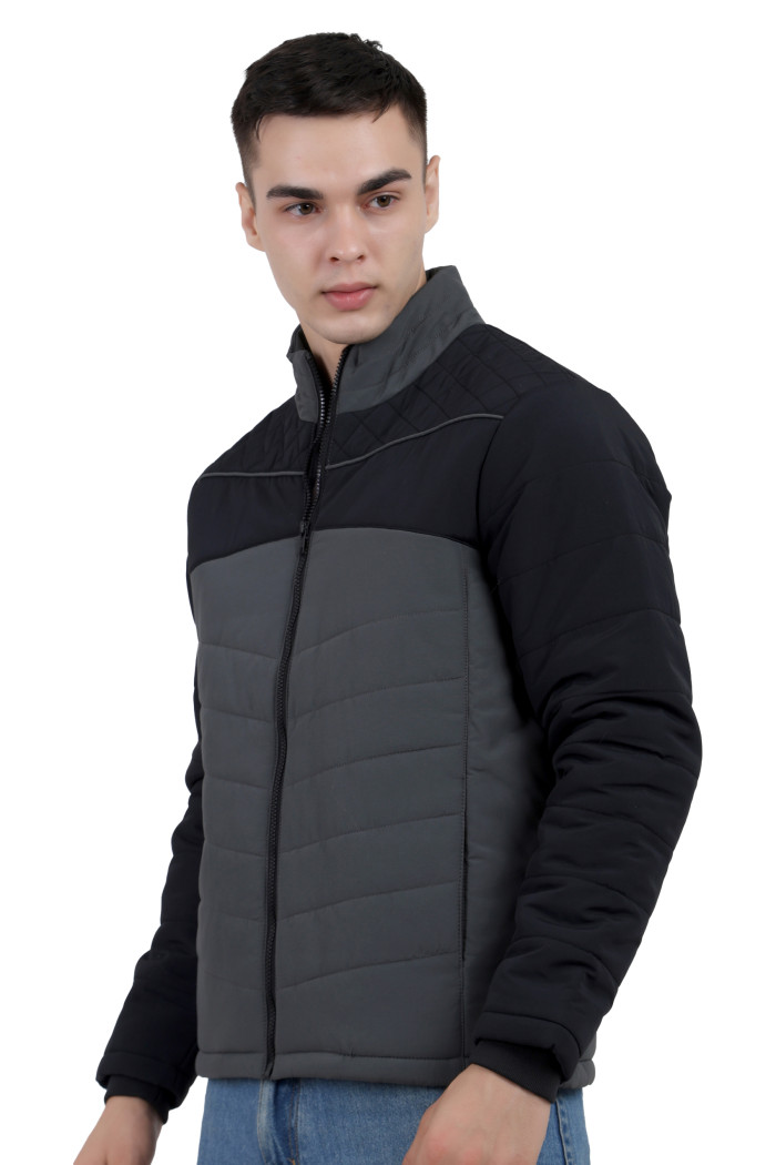 A left pose of a man wearing a Black-Grey dual Tone Quilted Jacket with mock collar, zipper closure and pocket in hand designed for casual winter layering and comfort.