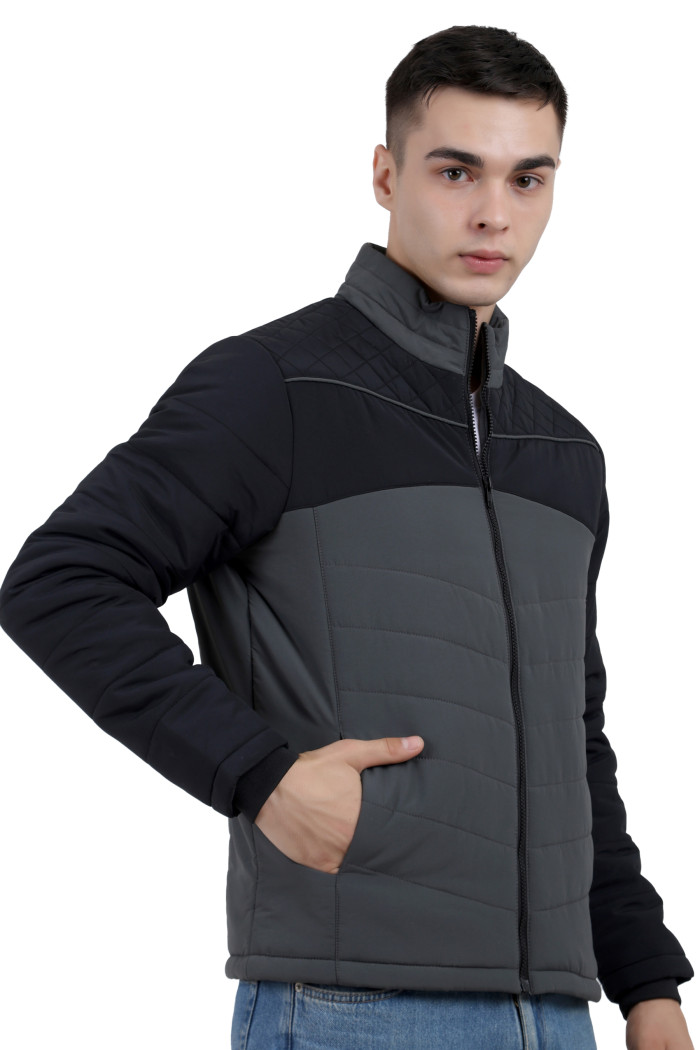 A right pose of a man wearing a Black-Grey dual Tone Quilted Jacket with mock collar, zipper closure and pocket in hand designed for casual winter layering and comfort.