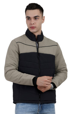 A man wearing a Black-Camel dual Tone Quilted Jacket with mock collar, zipper closure, and pocket in hand designed for casual winter layering and comfort.