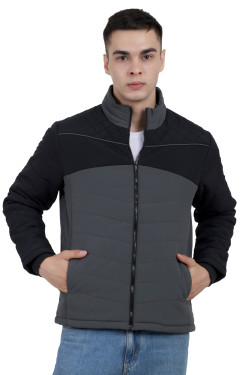 A man wearing a Black-Grey dual Tone Quilted Jacket with mock collar, zipper closure, and pocket in hand designed for casual winter layering and comfort.