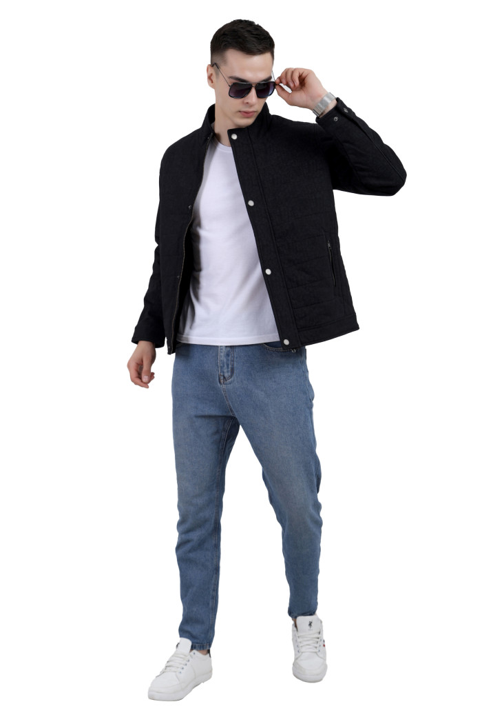 A tilted pose of a man wearing an olive High Neck Quilted Jacket with zipper closure Button Placket, and pocket in hand designed for casual winter layering and comfort.