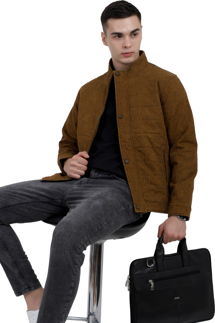 A tilted pose of a man wearing a mustard High Neck Quilted Jacket with zipper closure Button Placket, and pocket in hand designed for casual winter layering and comfort.