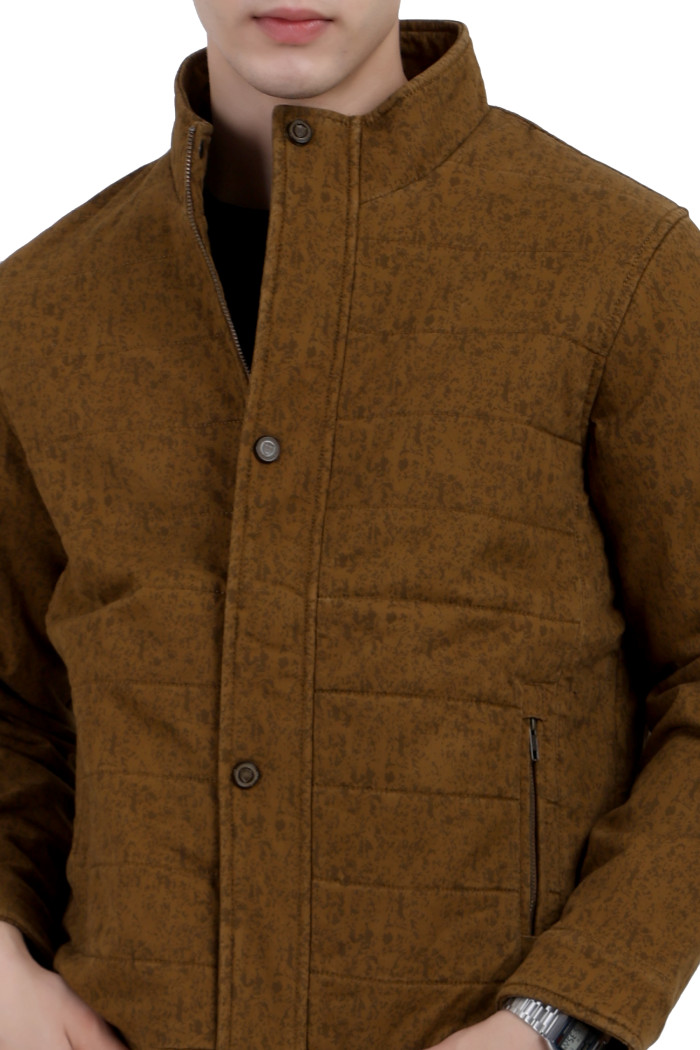 A cropped image of a man wearing a mustard High Neck Quilted Jacket with mock collar, zipper closure Button Placket, and pocket in hand designed for casual winter layering and comfort.