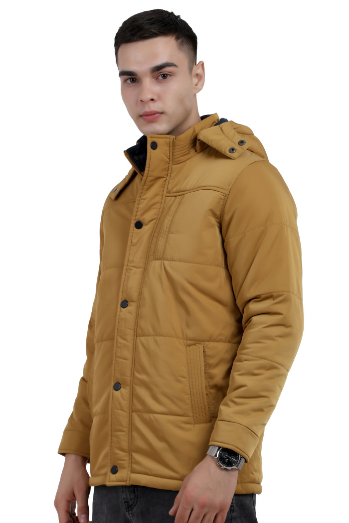 A left pose of a man wearing a Red quilted jacket with a high neck collar, hood , zipper closure and pocket in hand designed for casual winter layering and comfort.