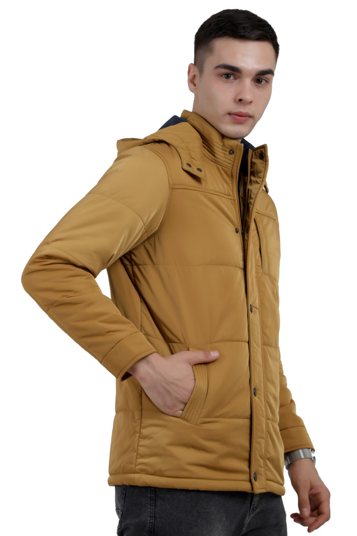 A right pose of a Mustard wearing aRed quilted jacket with a high neck collar, hood , zipper closure and pocket in hand designed for casual winter layering and comfort.