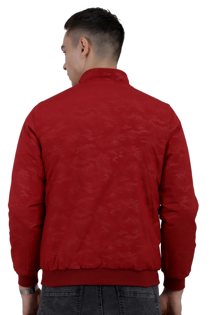 A back pose of a man wearing a Red- Navy Reversible jacket with a high neck collar, zipper closure, and pocket in hand designed for casual winter layering and comfort.