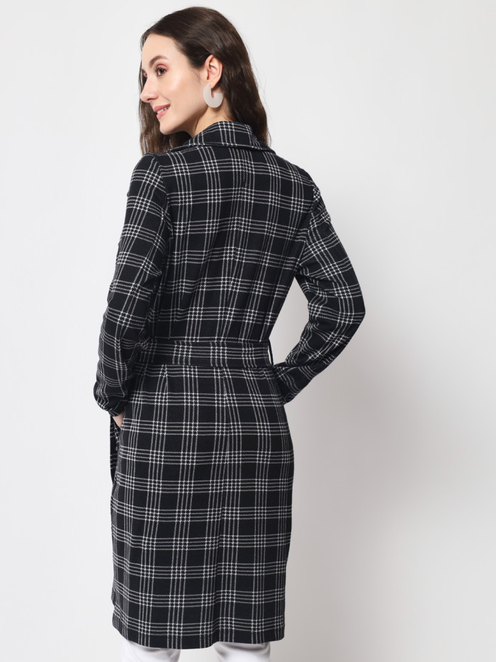 A back pose of a woman wearing a Black Checkered Long Coat with a lapel collar and matching belt designed for formal and casual winter layering and comfort.