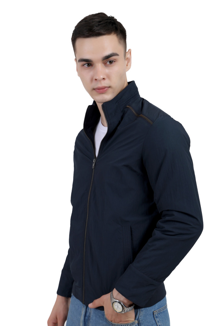 A right pose of a man wearing a Navy Riding jacket with a high collar neck, zipper closure and pocket in hand designed for casual winter layering and comfort.