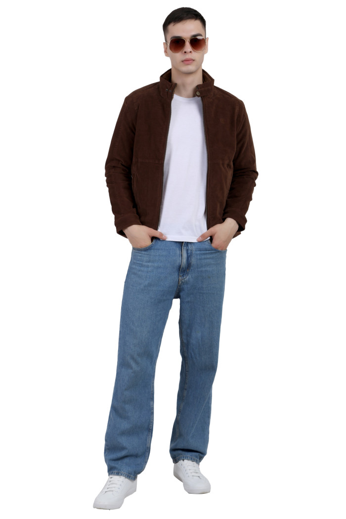 A tilted pose of a man wearing a Brown Corduroy jacket with a collar neck, zipper closure and pocket in hand designed for casual winter layering and comfort.