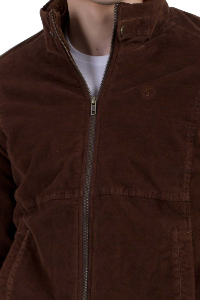 A cropped image of a man wearing a Brown Corduroy jacket with a collar neck, zipper closure and pocket in hand designed for casual winter layering and comfort.