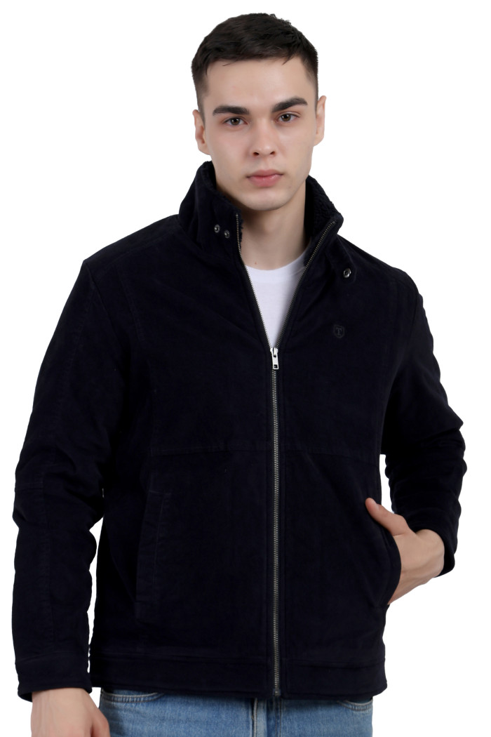 A man wearing a Navy Corduroy jacket with a collar neck, zipper closure and pocket in hand designed for casual winter layering and comfort.