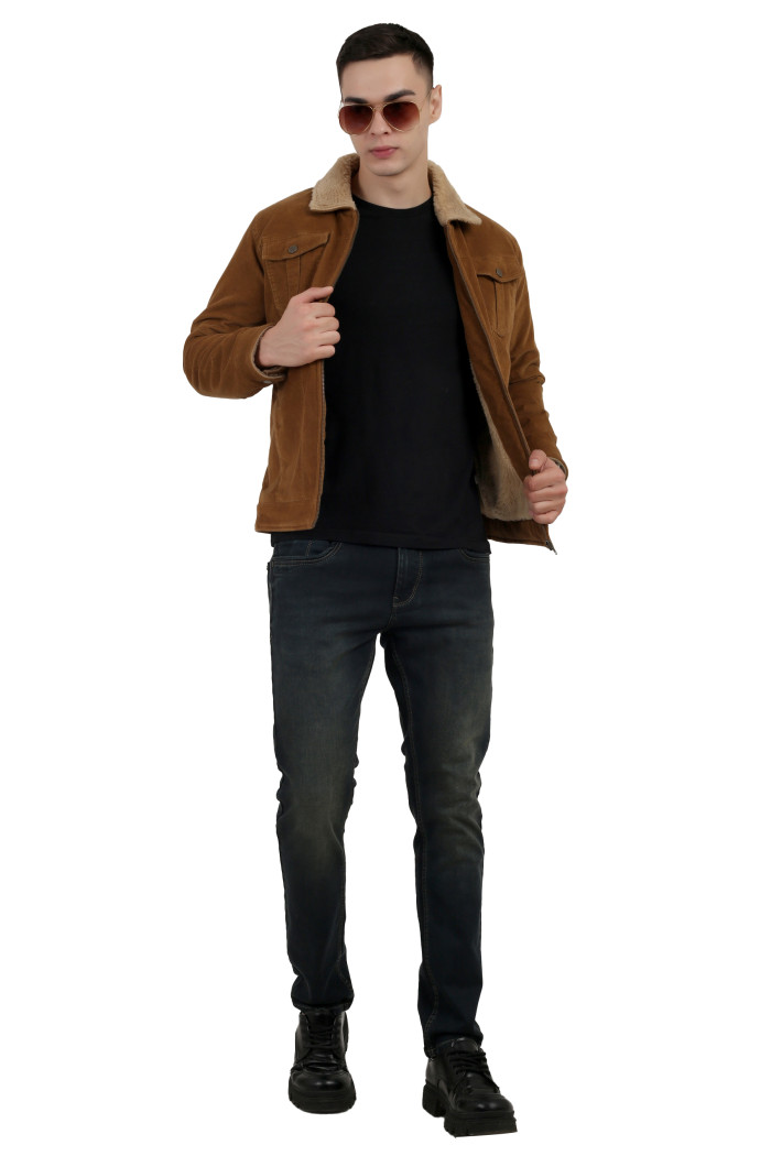 A tilted pose of a man wearing a Khaki Corduroy jacket with a collar neck, zipper closure and pocket in hand designed for casual winter layering and comfort.