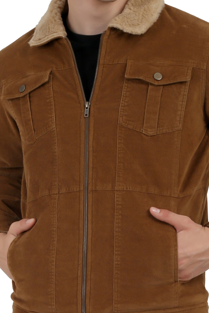 A cropped image of a man wearing a Khaki Corduroy jacket with a collar neck, zipper closure and pocket in hand designed for casual winter layering and comfort.