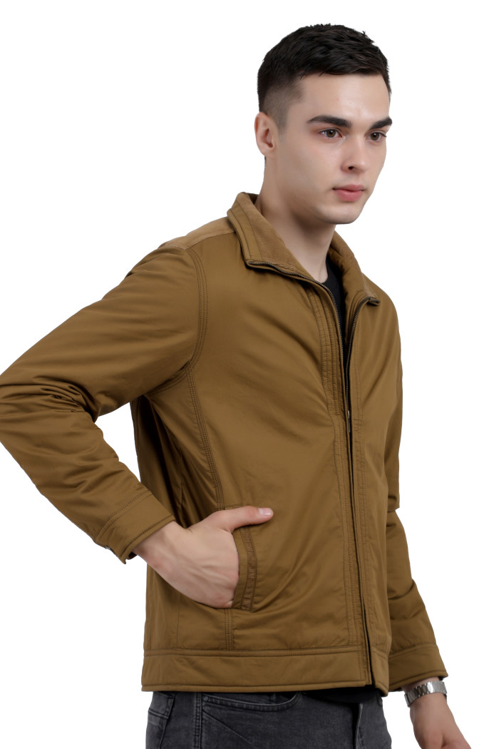 A left pose of a man wearing a Khaki cotton jacket with a collar neck, zipper closure and pocket in hand designed for casual winter layering and comfort.