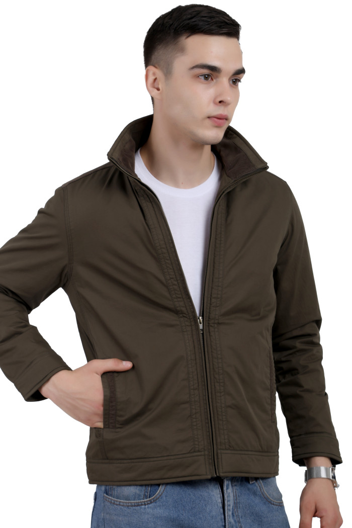 A man wearing an Olive cotton jacket with a collar neck, zipper closure and pocket in hand designed for casual winter layering and comfort.