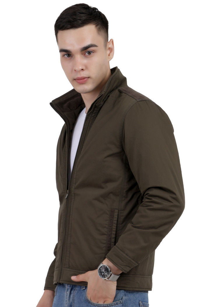 A right pose of a man wearing an Olive cotton jacket with a collar neck, zipper closure and pocket in hand designed for casual winter layering and comfort.