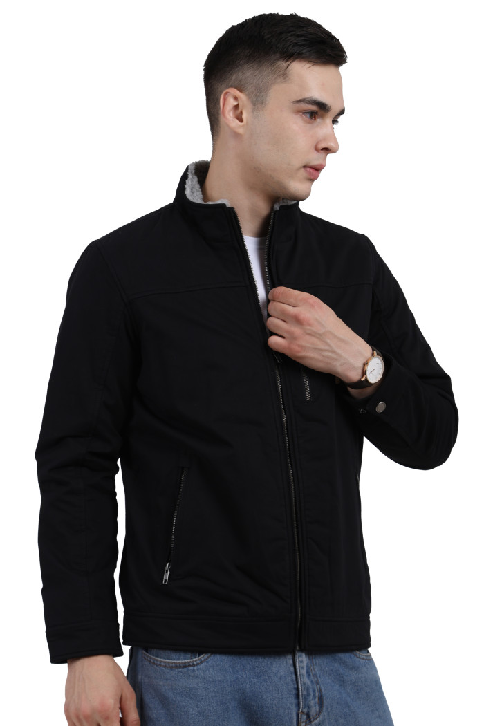 A left pose of a man wearing a Black cotton jacket with a collar neck, zipper closure and pocket in hand designed for casual winter layering and comfort.