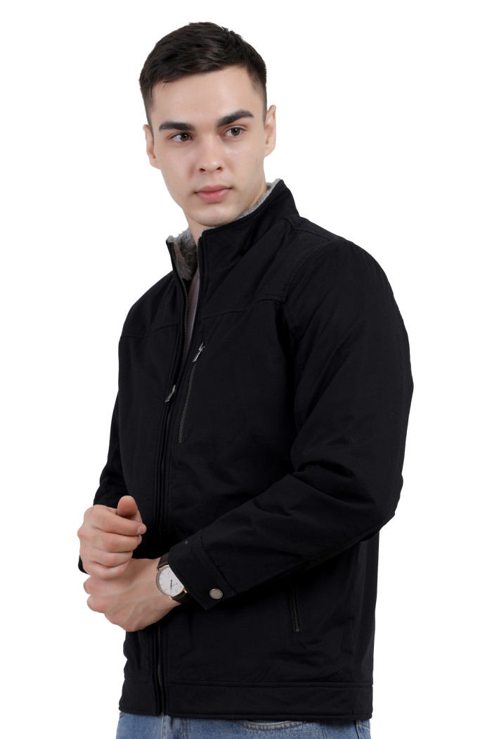 A right pose of a man wearing a Black cotton jacket with a collar neck, zipper closure and pocket in hand designed for casual winter layering and comfort.