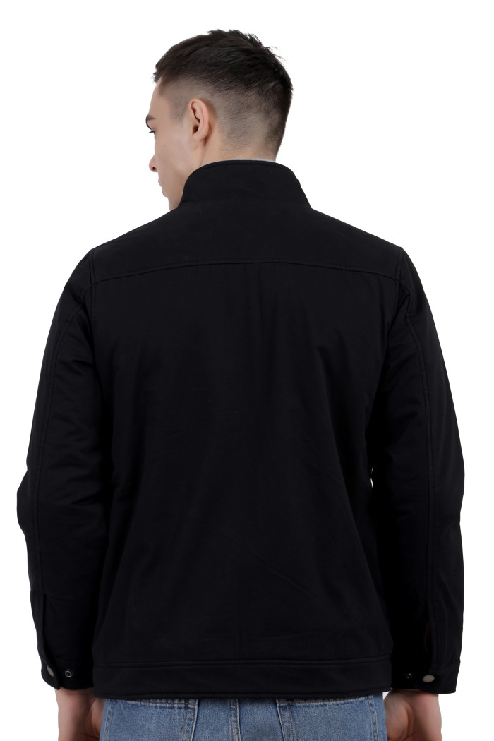 A back pose of a man wearing a Black cotton jacket with a collar neck, zipper closure and pocket in hand designed for casual winter layering and comfort.