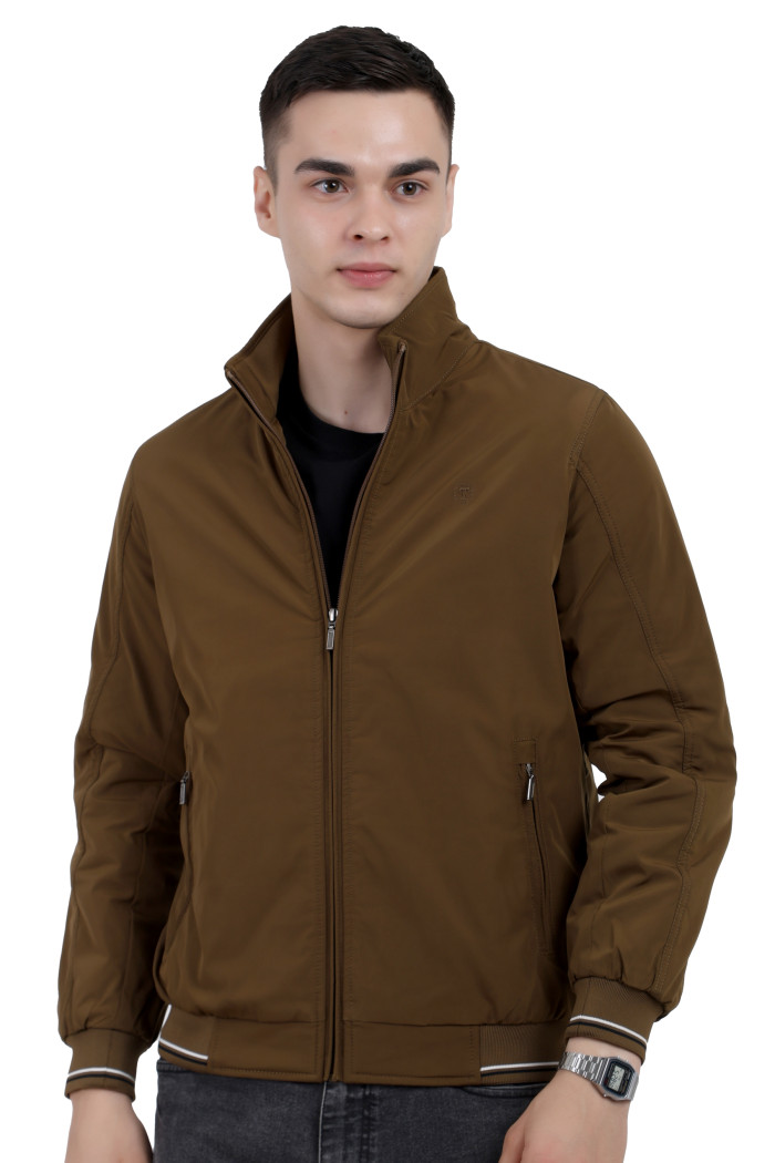 A man wearing a Khaki polyester jacket with a collar neck, zipper closure and pocket in hand designed for casual winter layering and comfort.