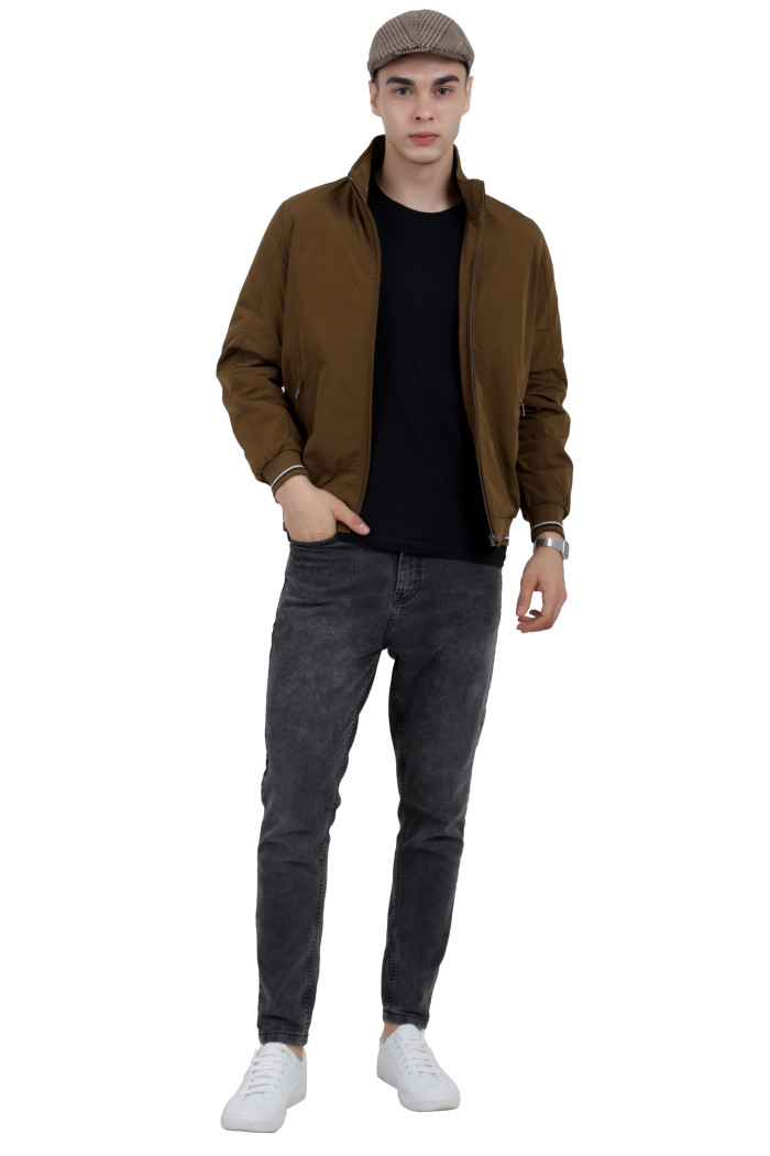 A tilted pose of a man wearing a Khaki polyester jacketwith a collar neck, zipper closure and pocket in hand designed for casual winter layering and comfort.