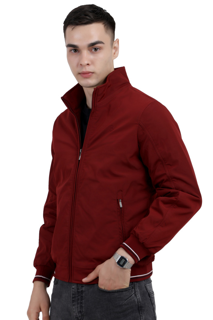 A right pose of a man wearing a Maroon polyester jacket with a collar neck, zipper closure and pocket in hand designed for casual winter layering and comfort.