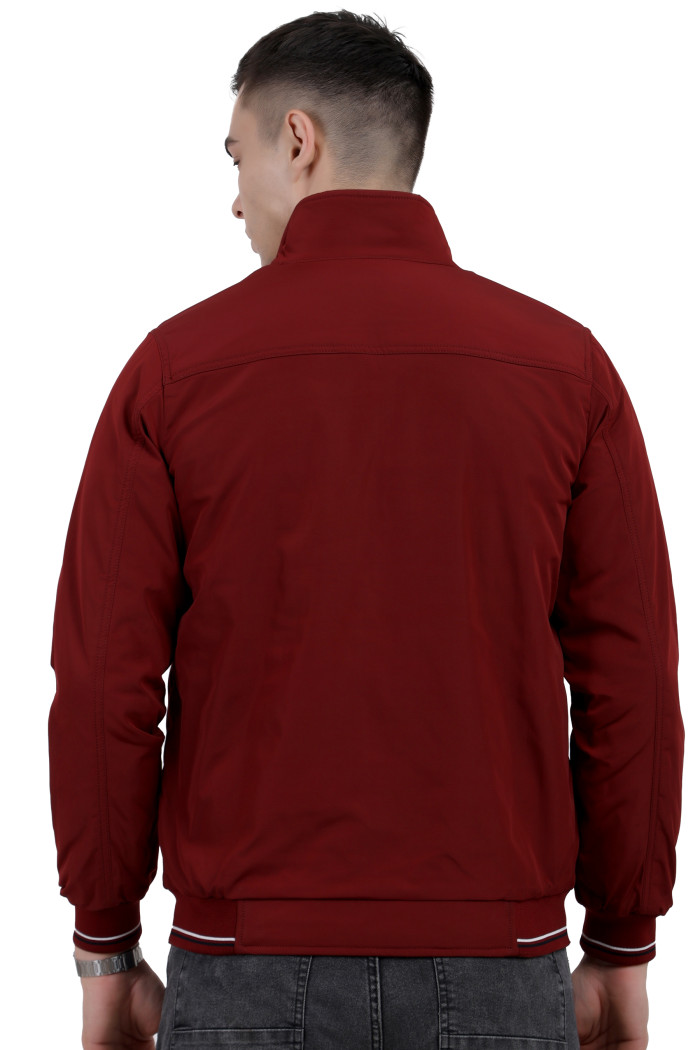 A back pose of a man wearing a Maroon polyester jacket with a collar neck, zipper closure and pocket in hand designed for casual winter layering and comfort.