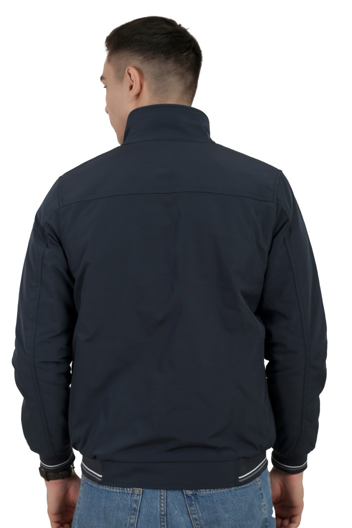 A back pose of a man wearing a Navy polyester jacket with a collar neck, zipper closure and pocket in hand designed for casual winter layering and comfort.