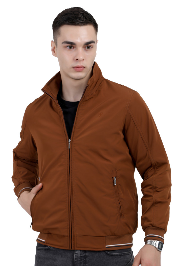 A cropped image of a man wearing a Rust polyester jacket with a collar neck, zipper closure and pocket in hand designed for casual winter layering and comfort.