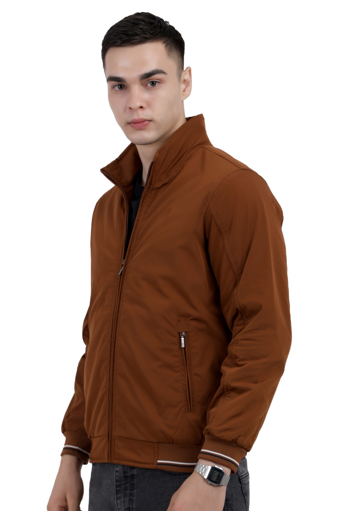 A right pose of a man wearing a Rust polyester jacket with a collar neck, zipper closure and pocket in hand designed for casual winter layering and comfort.