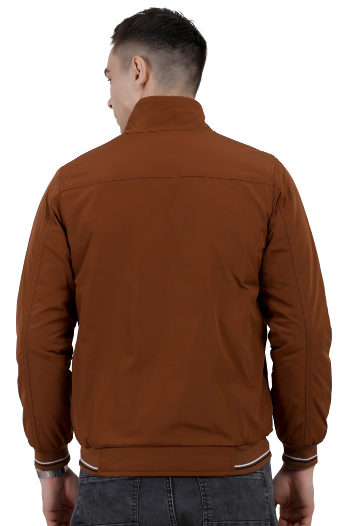 A back pose of a man wearing a Rust polyester jacket with a collar neck, zipper closure and pocket in hand designed for casual winter layering and comfort.