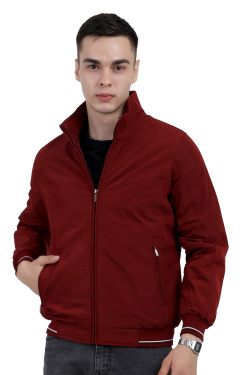 A man wearing a Maroon polyester jacket with a collar neck, zipper closure and pocket in hand designed for casual winter layering and comfort.