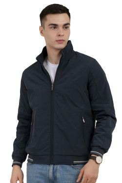 A man wearing a Navy polyester jacket with a collar neck, zipper closure and pocket in hand designed for casual winter layering and comfort.