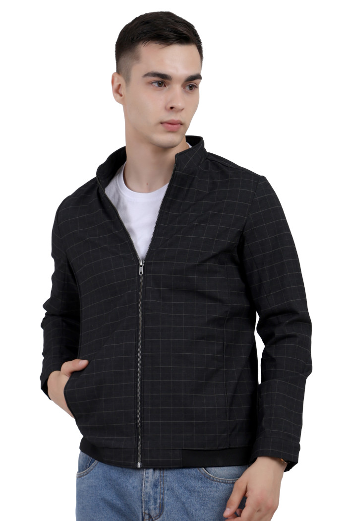 A man wearing a Black cotton washed winter jacket with fleece lining,mock collar, zipper closure, and pocket in hand designed for casual winter layering and comfort.