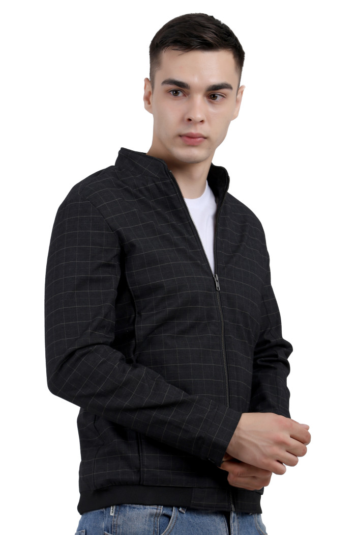 A left pose of a man wearing a Black cotton washed winter jacket with fleece lining,mock collar, zipper closure, and pocket in hand designed for casual winter layering and comfort.