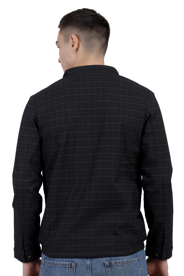 A back pose of a man wearing a Black cotton washed winter jacket with fleece lining,mock collar, zipper closure, and pocket in hand designed for casual winter layering and comfort.