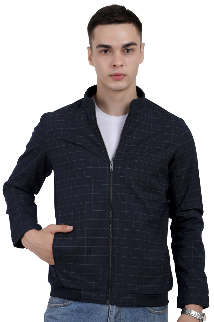 A man wearing a navy quilted biker Jacket with mock collar, zipper closure, and pocket in hand designed for casual winter layering and comfort.