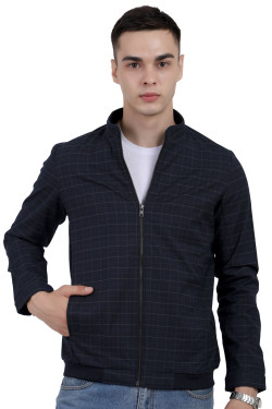 A man wearing a navy cotton washed winter jacket with fleece lining,mock collar, zipper closure, and pocket in hand designed for casual winter layering and comfort.