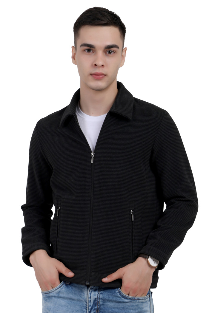 A tilted pose of a man wearing a Black Tweed Shacket with a collar neck, zipper closure and pocket in hand designed for casual winter layering and comfort.