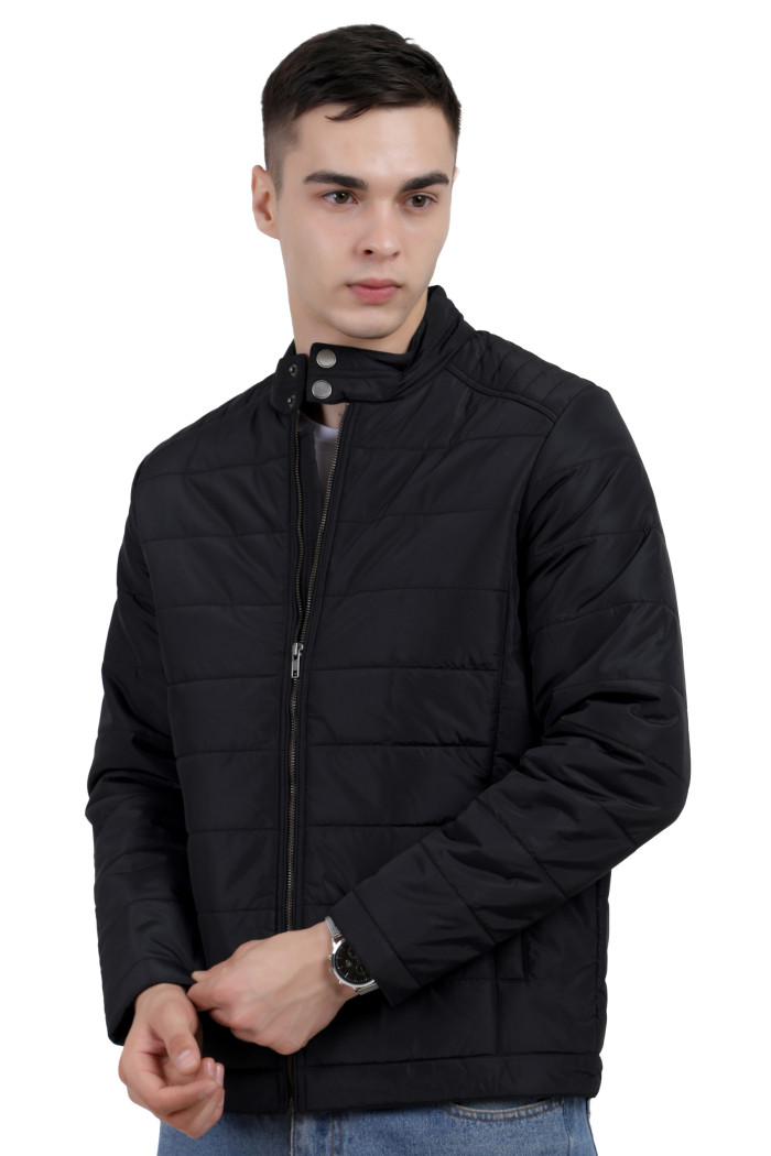 A right pose of a man wearing a black quilted biker Jacket with mock collar, zipper closure and pocket in hand designed for casual winter layering and comfort.