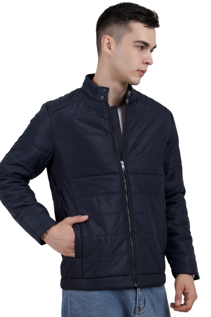 A right pose of a man wearing a navy quilted biker Jacket with mock collar, zipper closure and pocket in hand designed for casual winter layering and comfort.