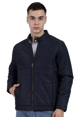 A man wearing a navy quilted biker Jacket with mock collar, zipper closure, and pocket in hand designed for casual winter layering and comfort.