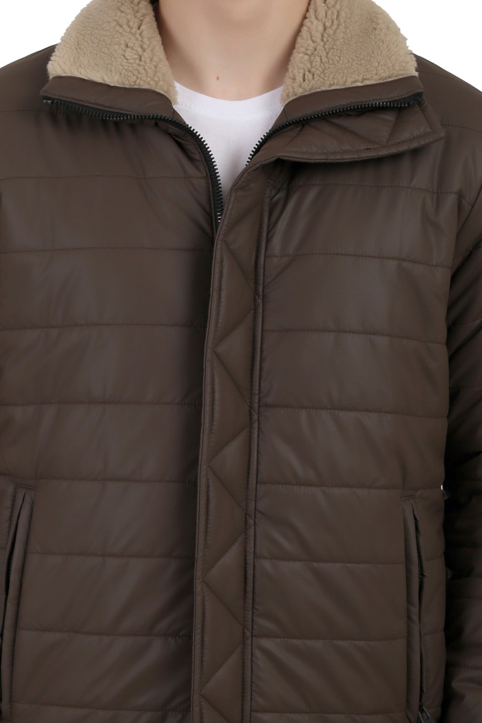 A cropped image of a man wearing a coffee High Neck Leather look Jacket with zipper closure, and pocket in hand designed for casual winter layering and comfort.