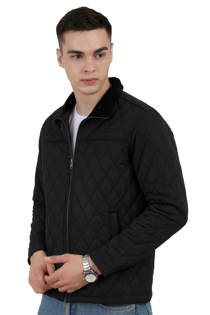 A left pose of a man wearing a Black quilted jacket with a collar neck, zipper closure and pocket in hand designed for casual winter layering and comfort.