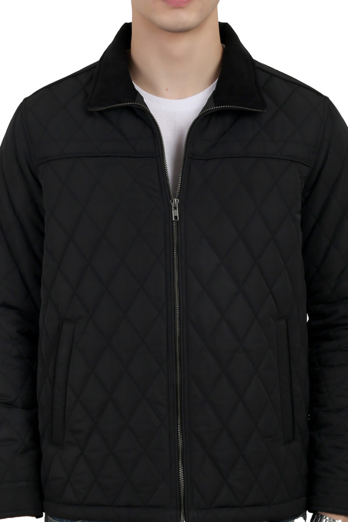 A cropped image of a man wearing a Black quilted jacket with a collar neck, zipper closure and pocket in hand designed for casual winter layering and comfort.